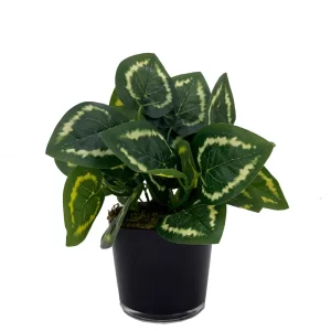 artificial plant potted in a black round pot